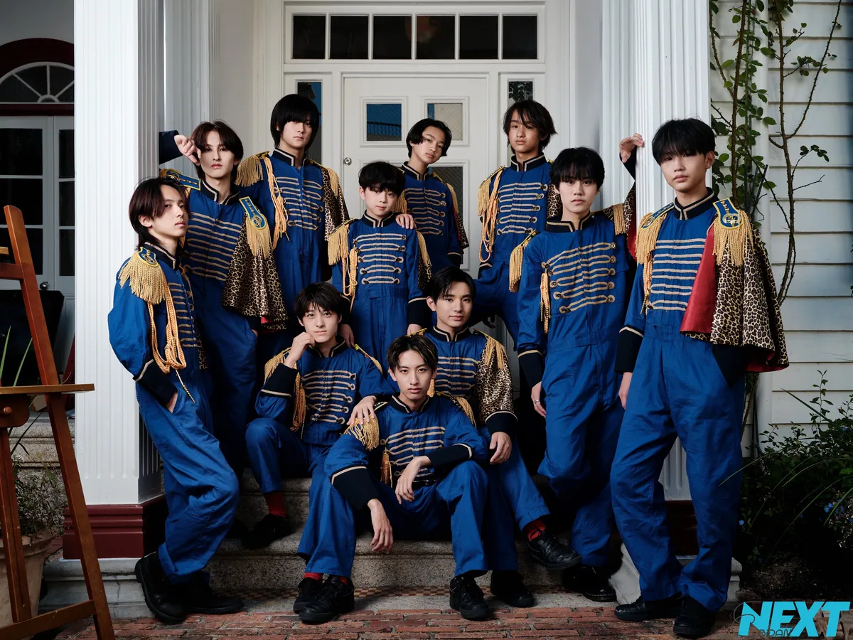 Members of EBiDAN OSAKA in blue costumes posing together